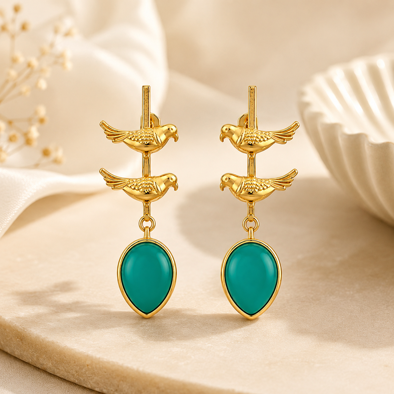Elegant Gold Bird Drop Earrings with Teal Teardrop Stones | Artisanal Jewelry